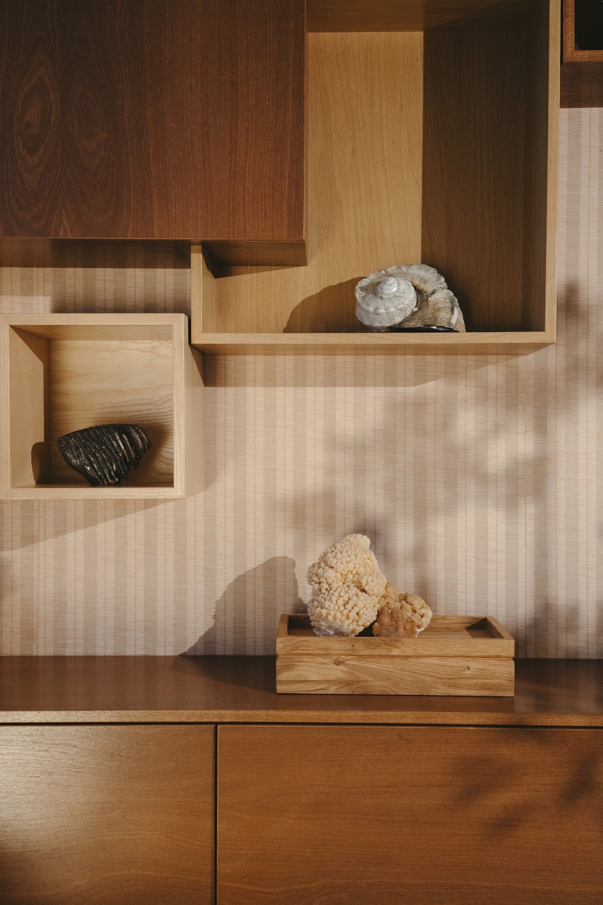 Solid oak Tray urn on a sideboard below an open wall shelf